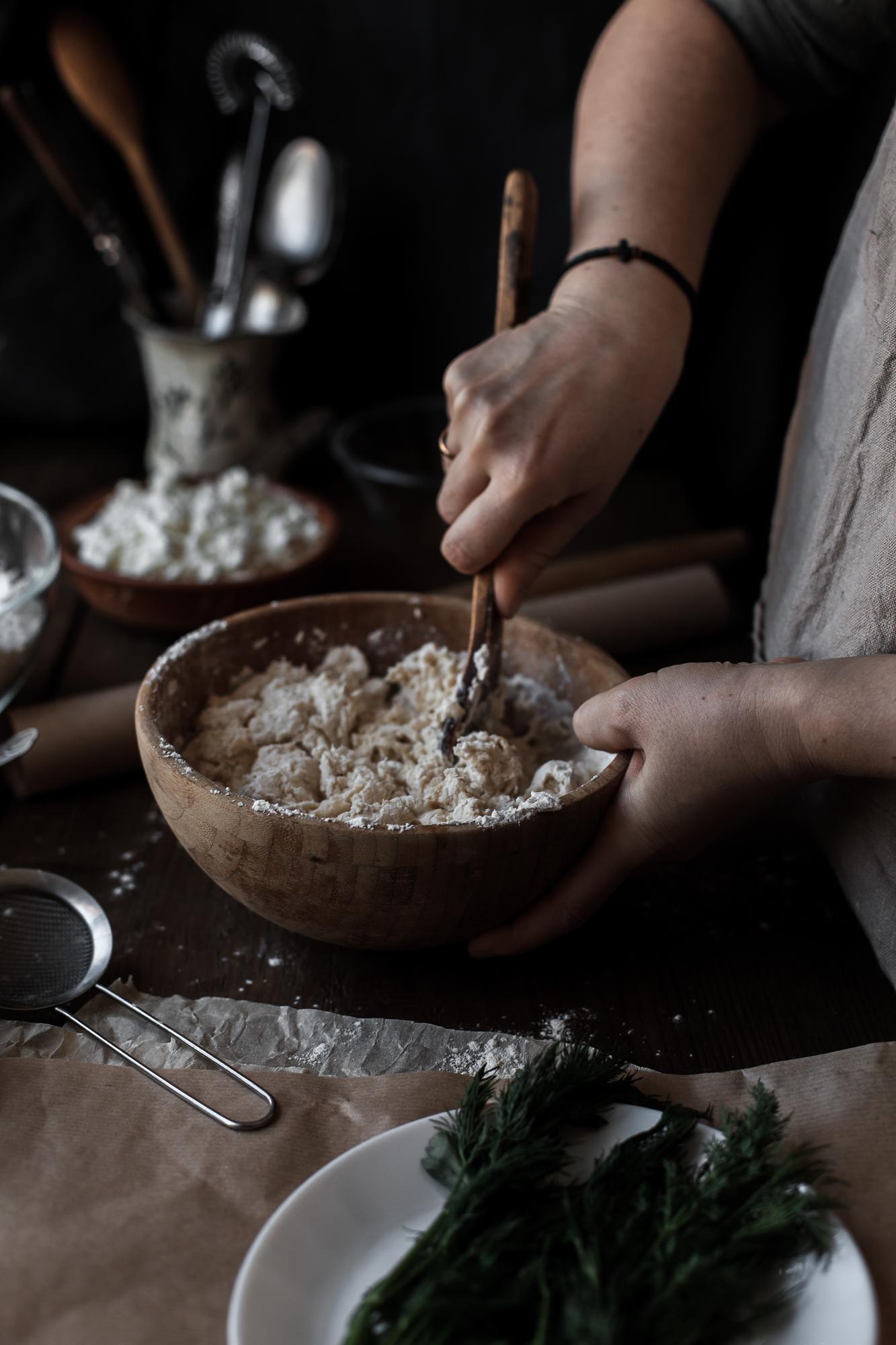 Hand mixing dough in natural light